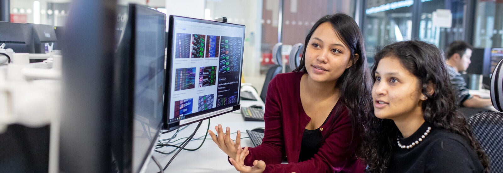 Students studying together on computer