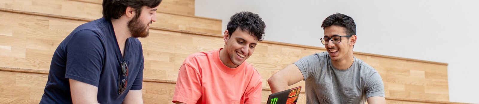 Students studying on lecture hall seats