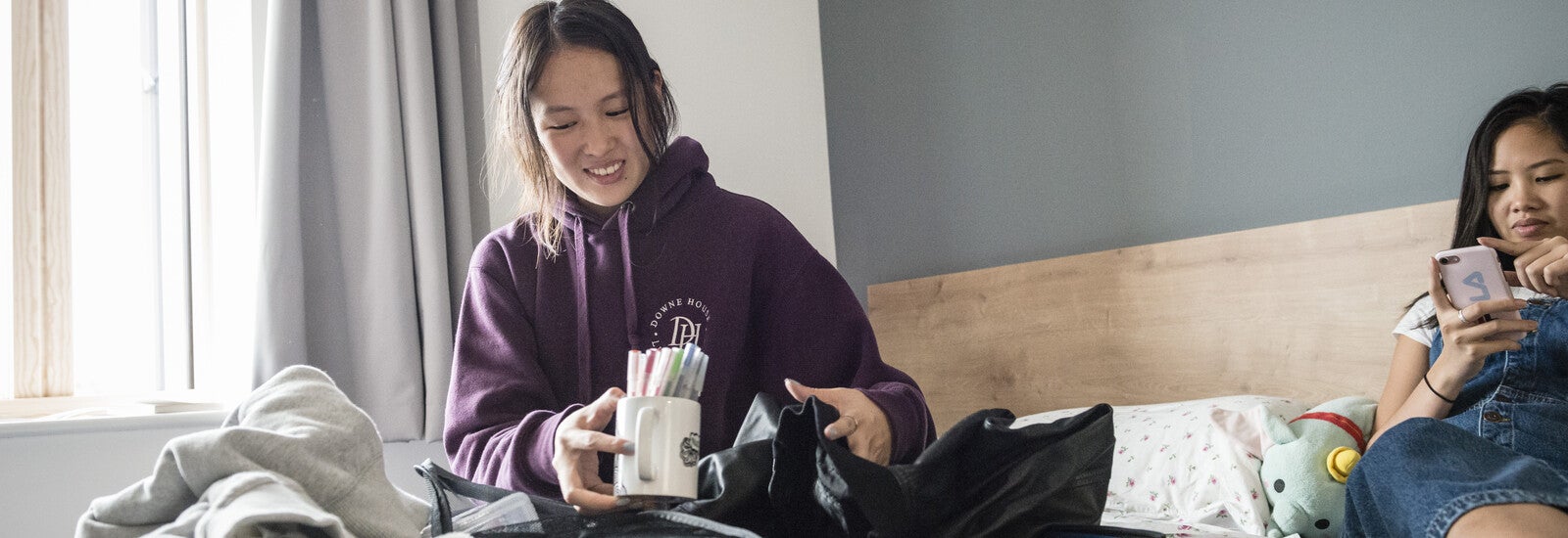 Surrey student on campus room bed