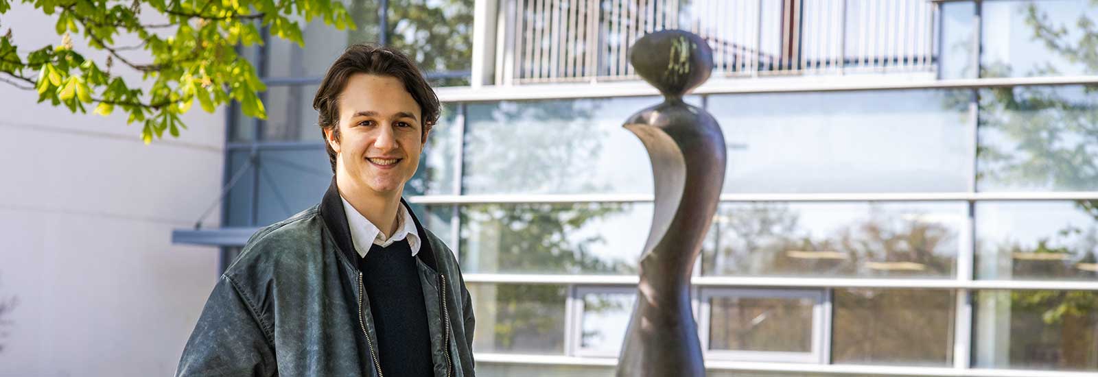 A Dublin ISC student stood next to a statue