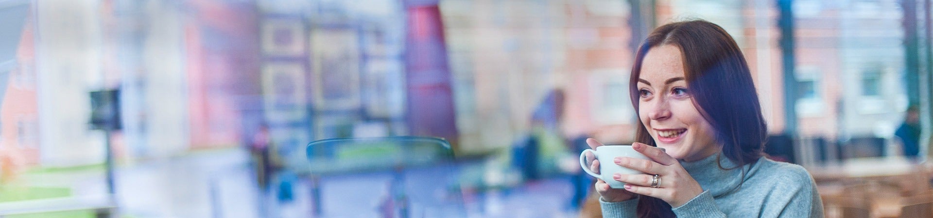Surrey student drinking coffee