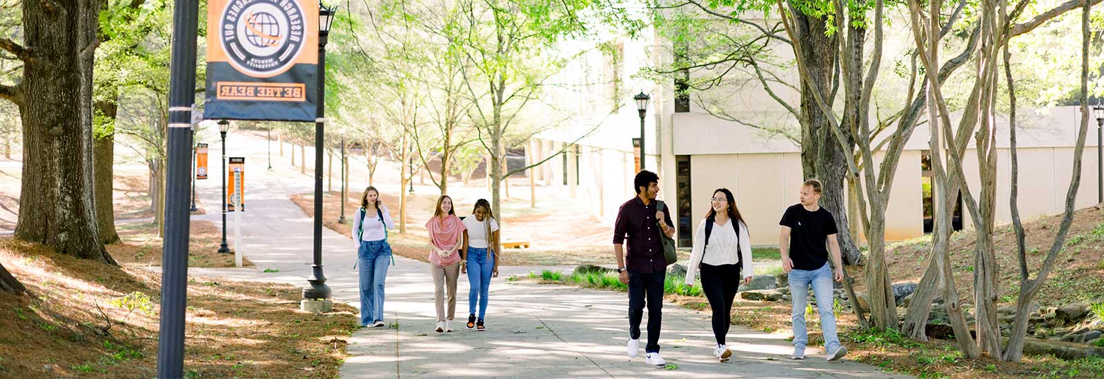 Two students walking outside campus