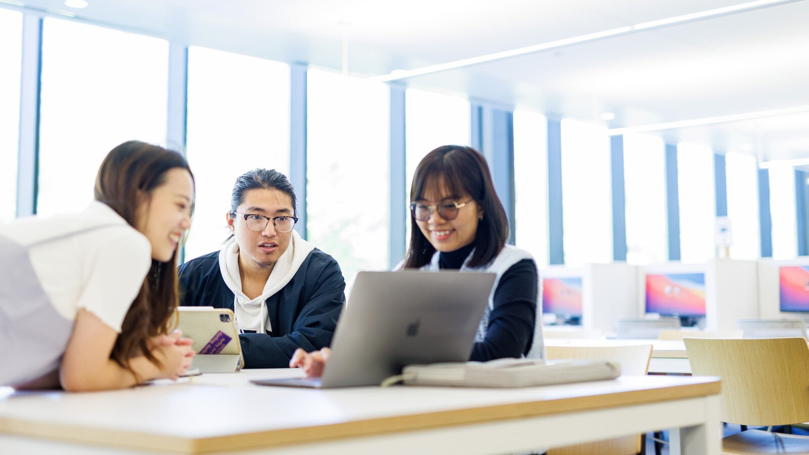 Student writing on whiteboard