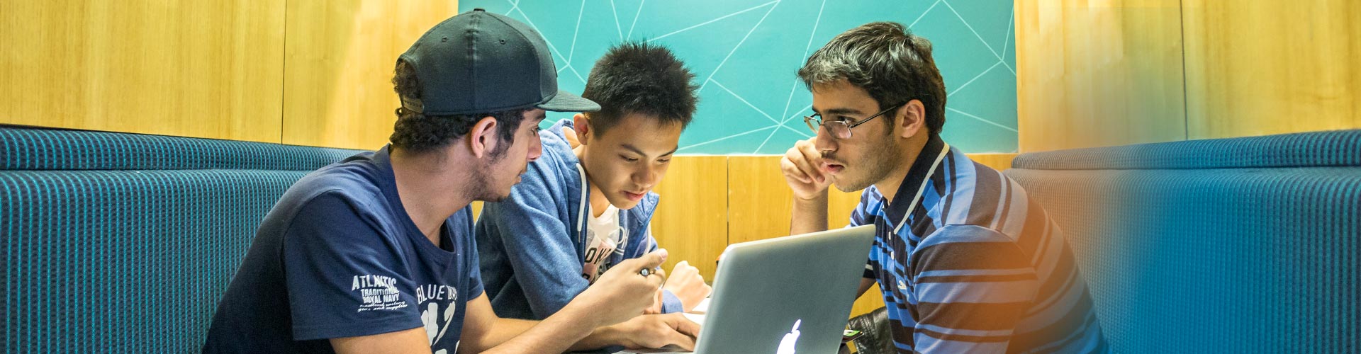 Strathclyde students studying together on laptop