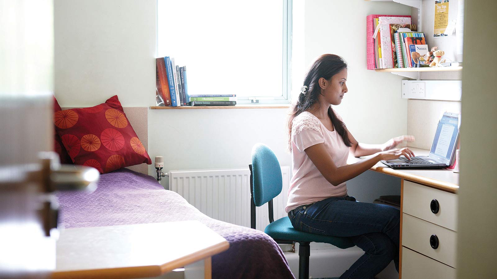 A student sat in accommodation