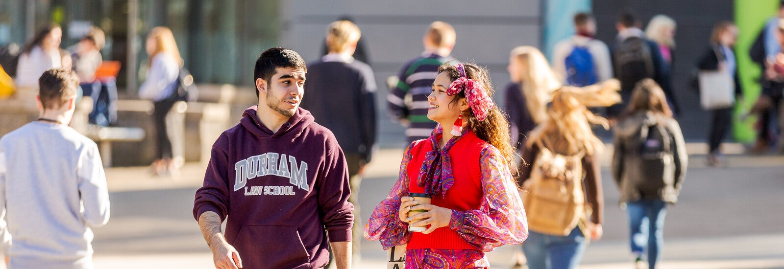 Students next to the river at Queen's Campus