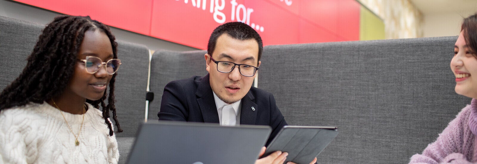 Students working on laptop and iPad