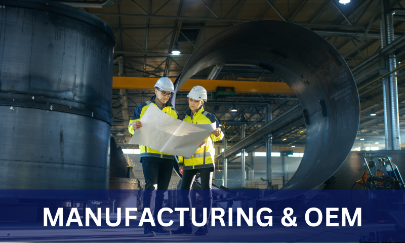 Manufacturing and OEM. Two people looing at a blueprint 