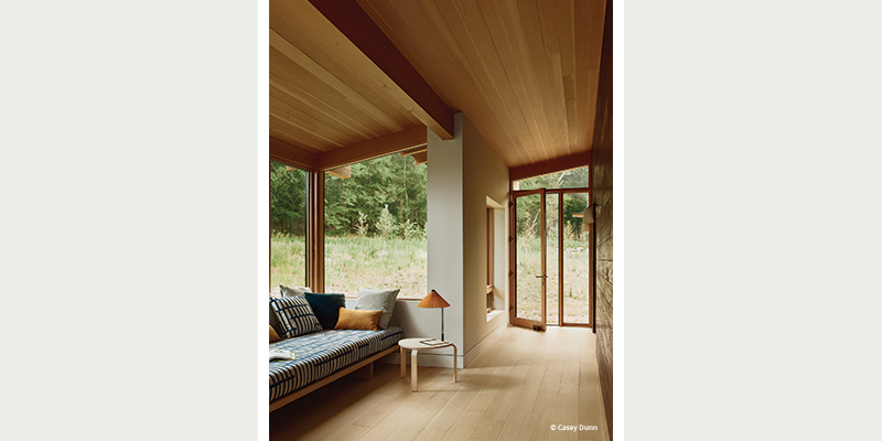 Trapezoid-shaped windows appear in the breezeway