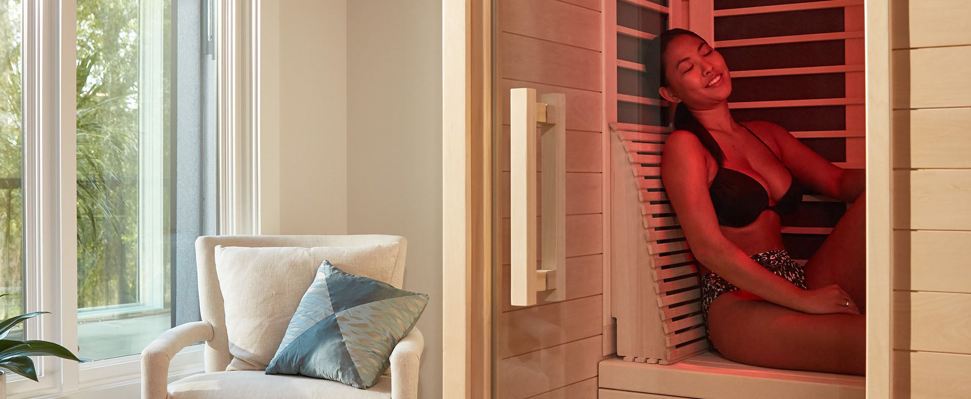 Woman relaxing in personal cabin sauna