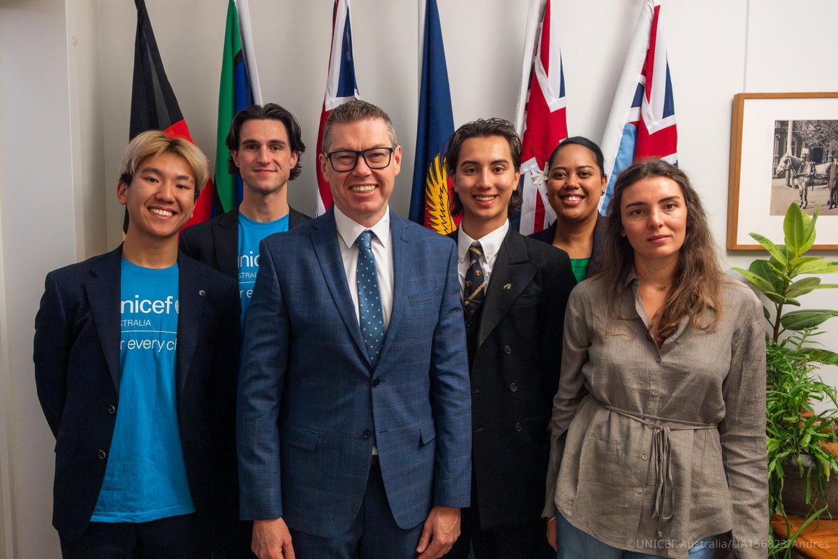UNICEF Australia Young Ambassadors pose for a group photo with Minister for Defence Industry and Pacific Island Affairs Pat Conroy at Parliament House in Canberra.