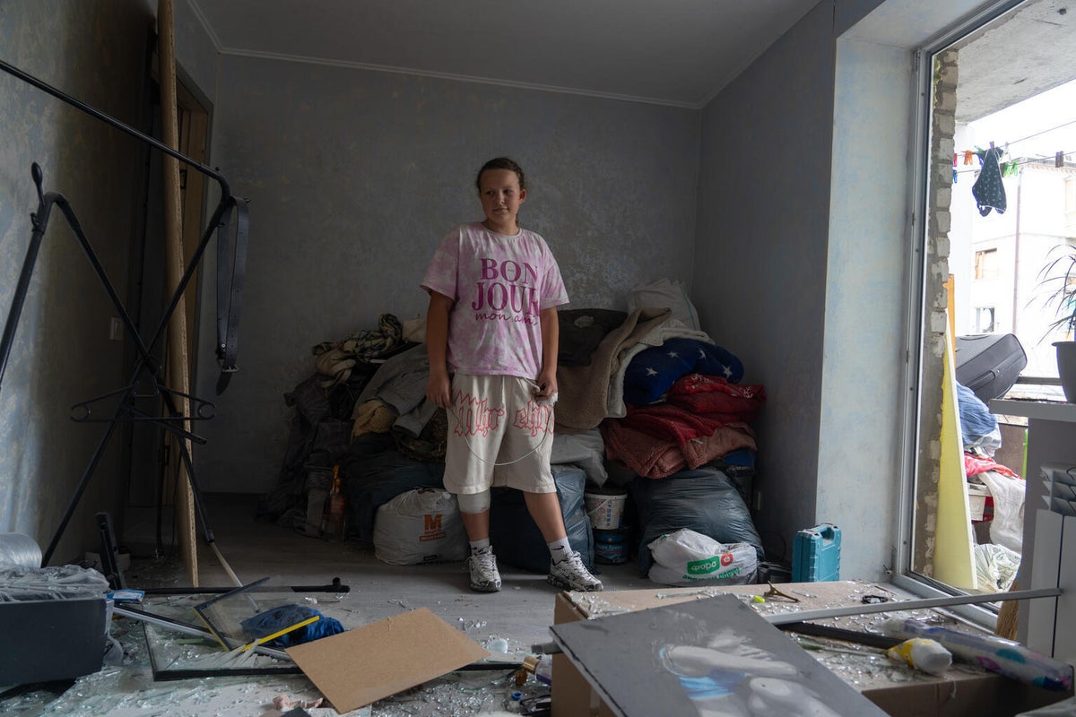 14-year-old Sofiia stands inside her family’s damaged flat in Kyiv, Ukraine, after an overnight attack.
