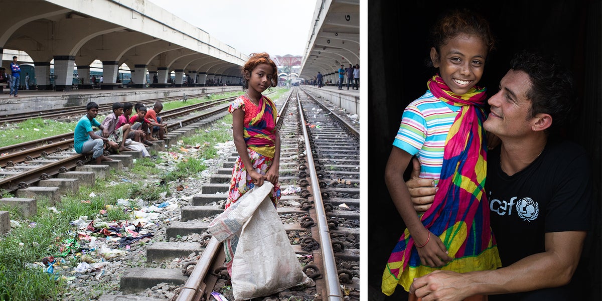 Dulaly, 10, stands with UNICEF Goodwill Ambassador Orlando Bloom in Kamalapur, Dhaka