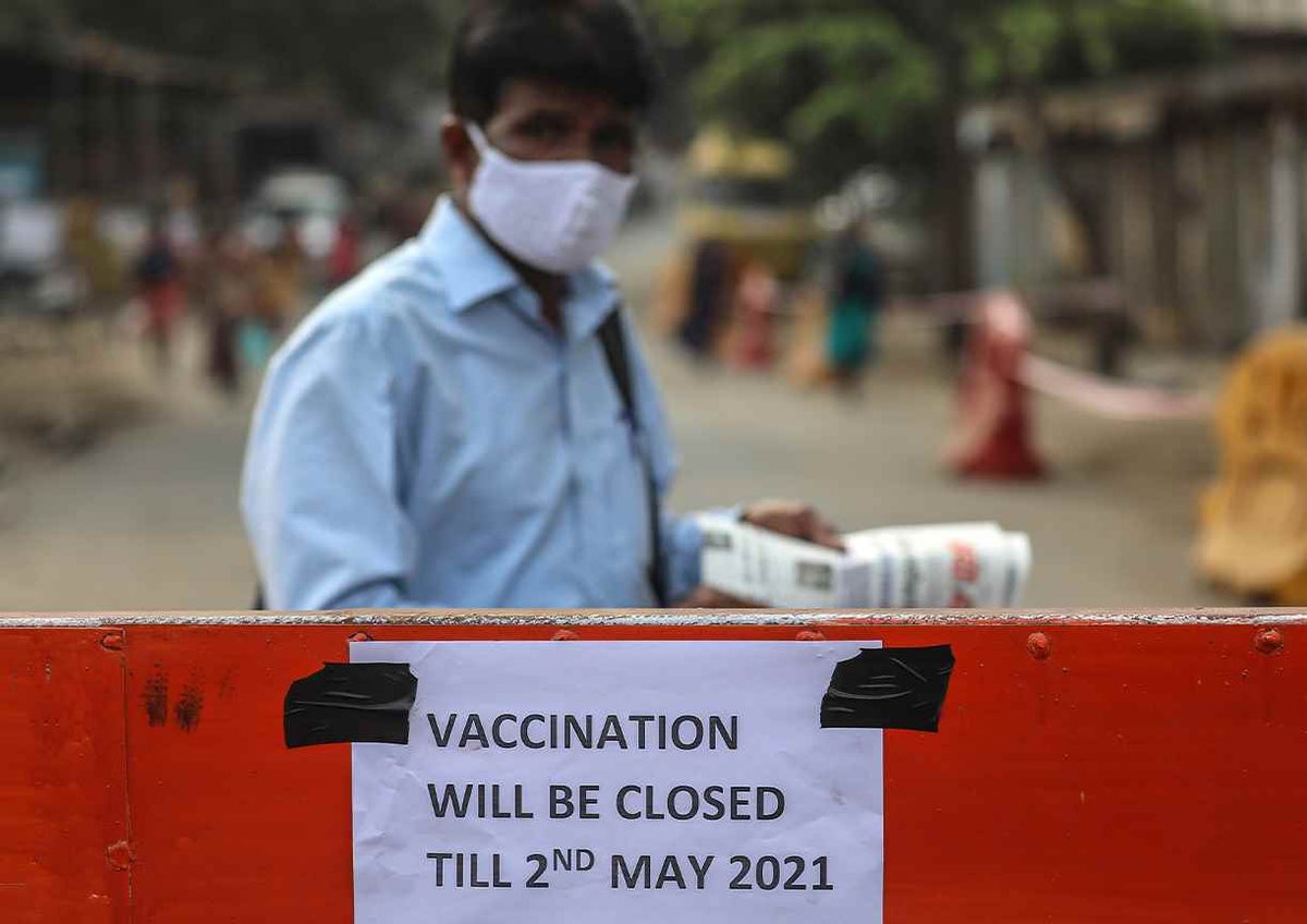 A notice is put up vaccination centres are closed for three days due to shortage of the COVID-19 vaccine in Mumbai, India