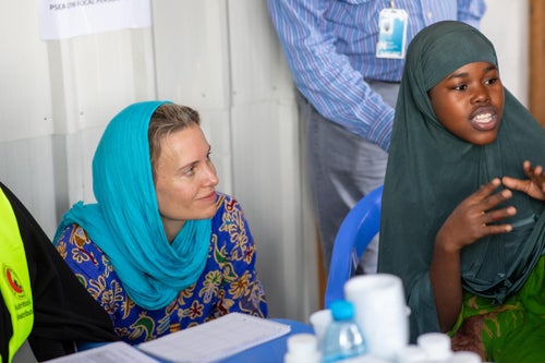 Woman listening as a girl speaks