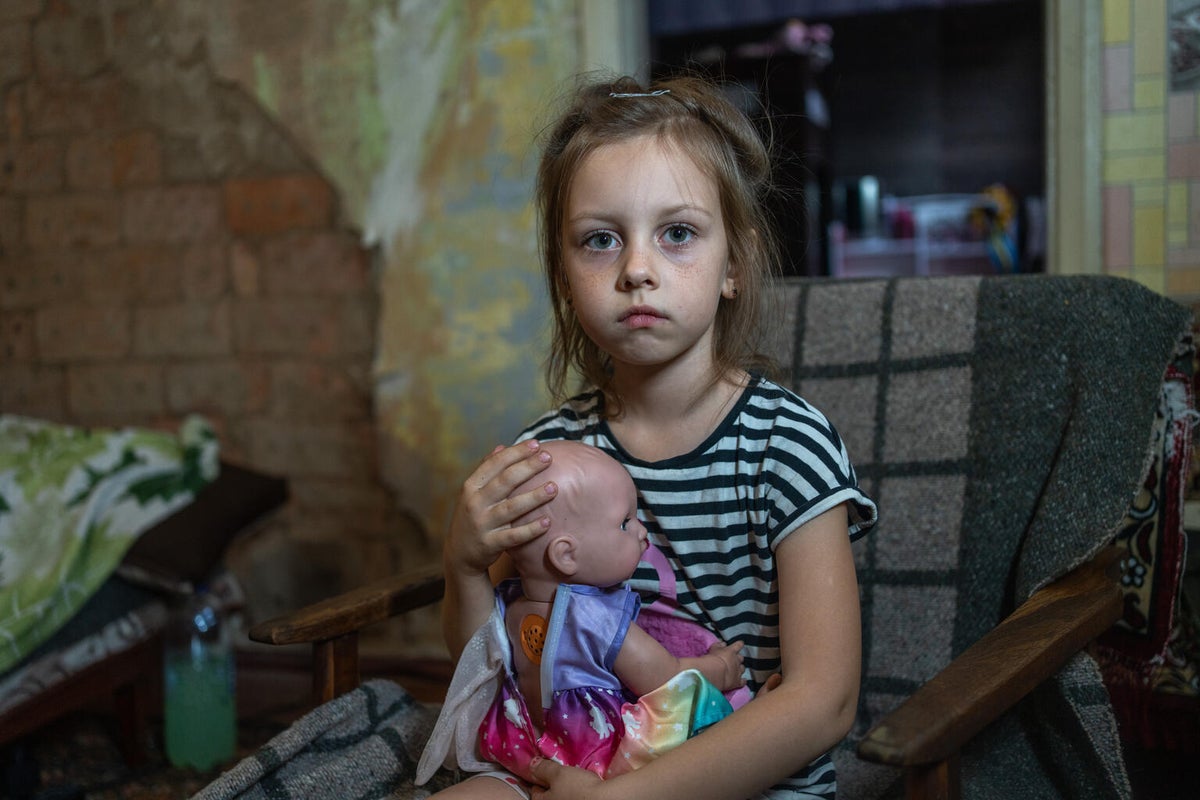 Seven-year-old Milana holds her favourite doll. The one item that meant the world to her when they were forced to evacuate.