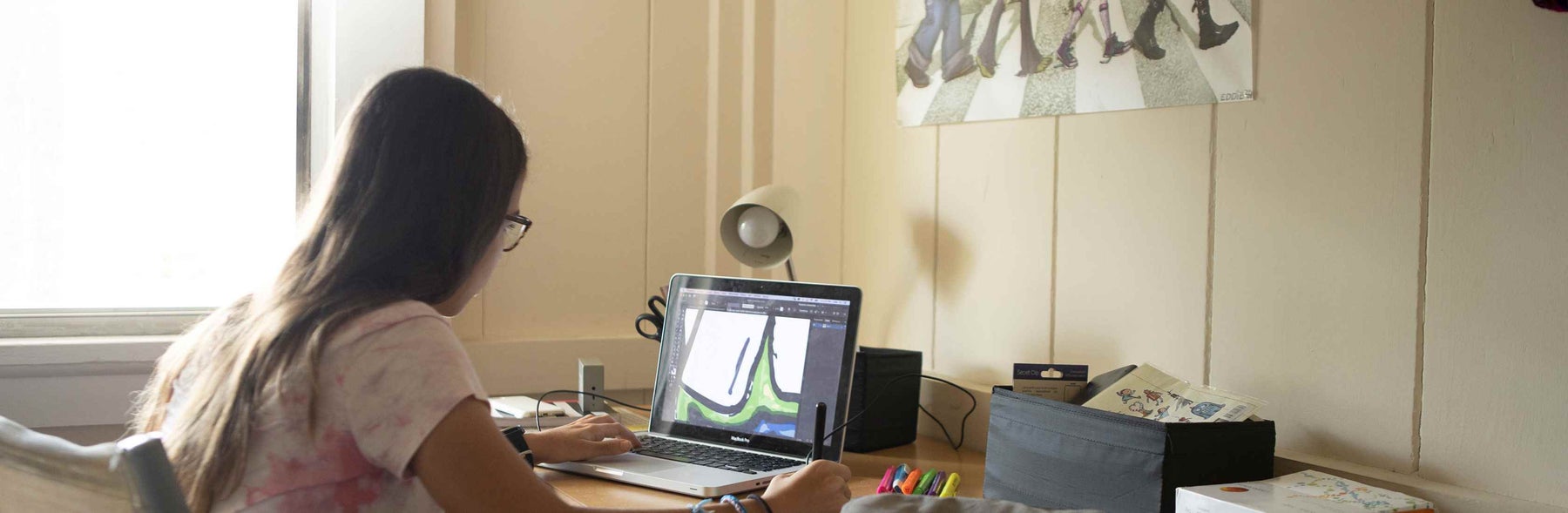 Girl looking at laptop screen