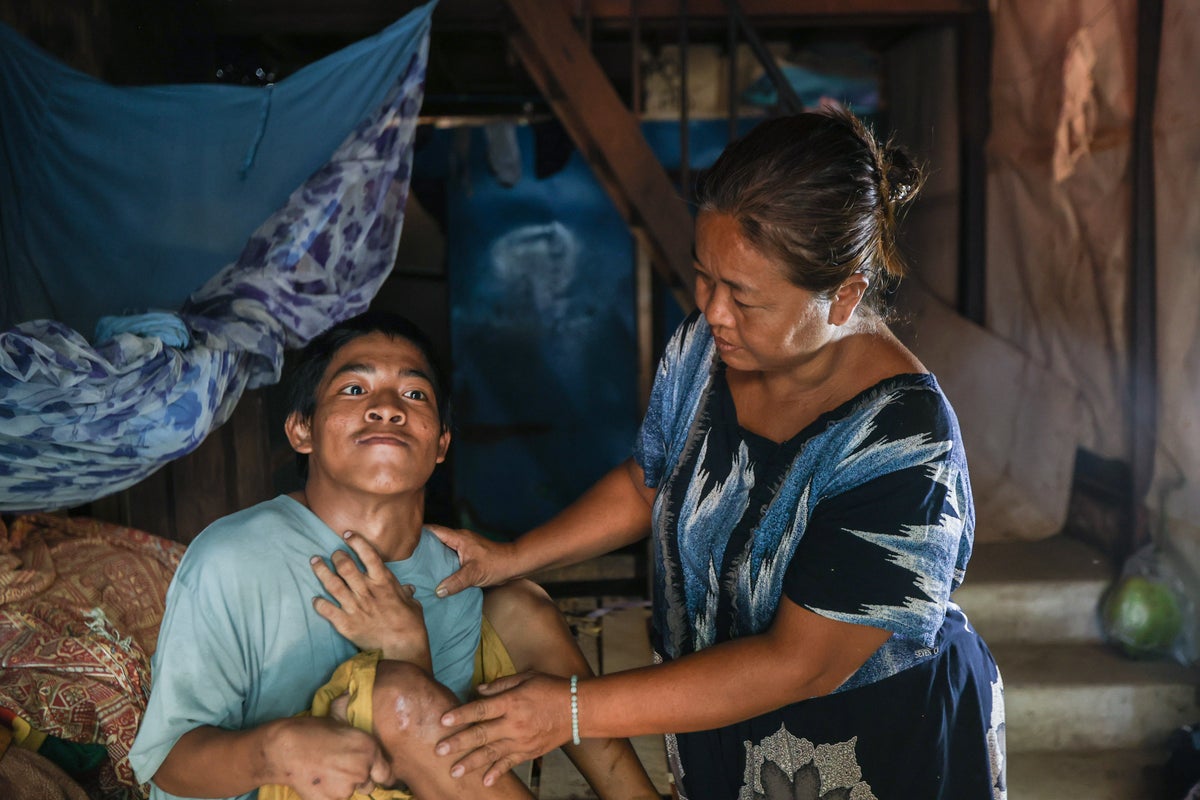 Min Khant from Mandalay, 18, who lives with a physical disability, benefits from UNICEF's humanitarian cash transfer program in the aftermath of the earthquake.