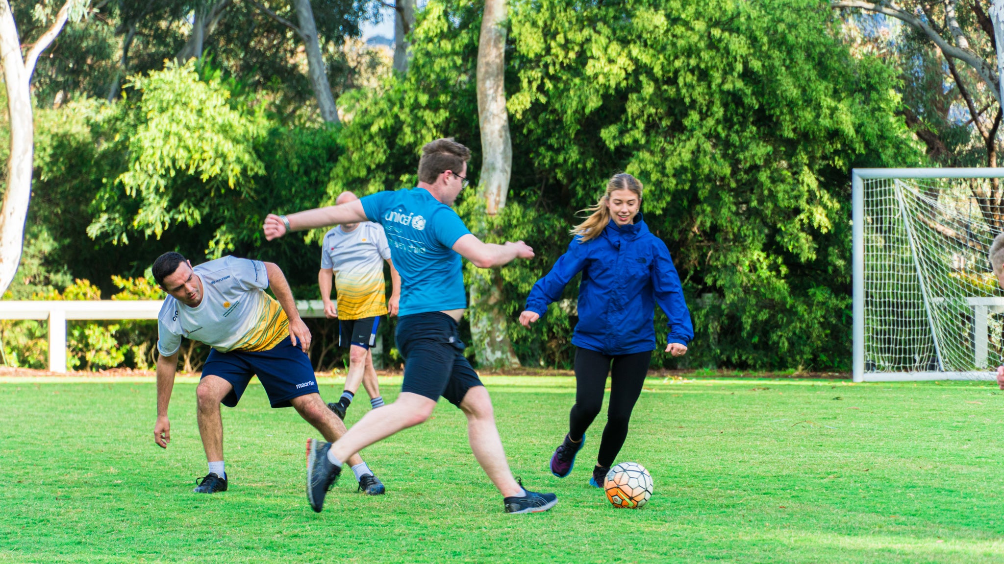Young Ambassadors play an early morning soccer match with ministers at Parliament House. 