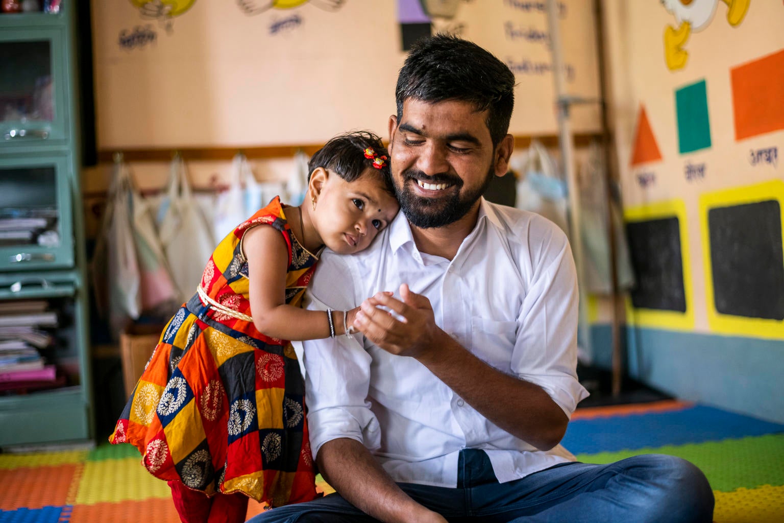 30 years old Yogesh Kulkarni plays with his 2 years old daughter Manyata at an Anganwadi centre in Karmad, Aurangabad.