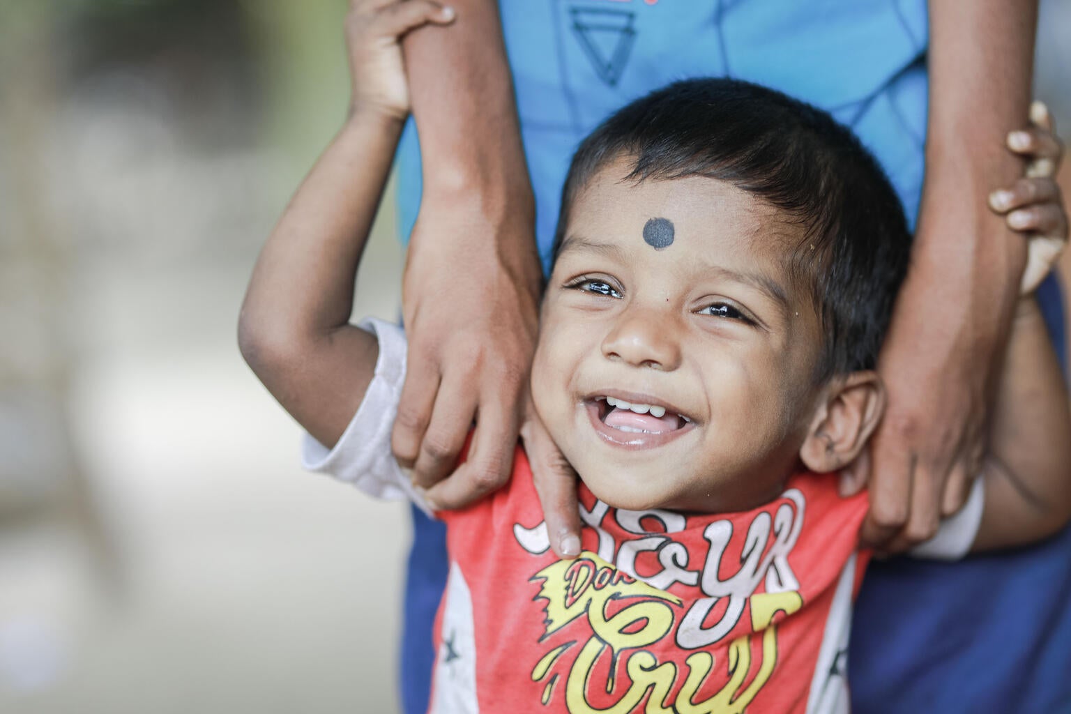  K. Premidan, 1 1/2, plays outside her home in Devapuram, in the Sri Lankan district of Batticaloa.
