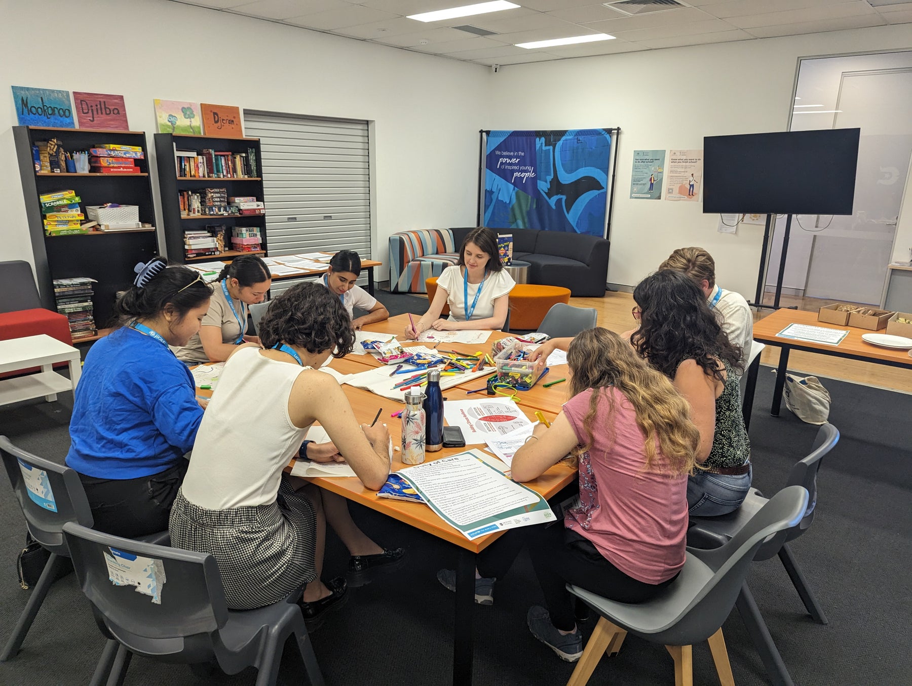 A group of young people sit around a table at the Australian Local Conference of Youth in Western Australia