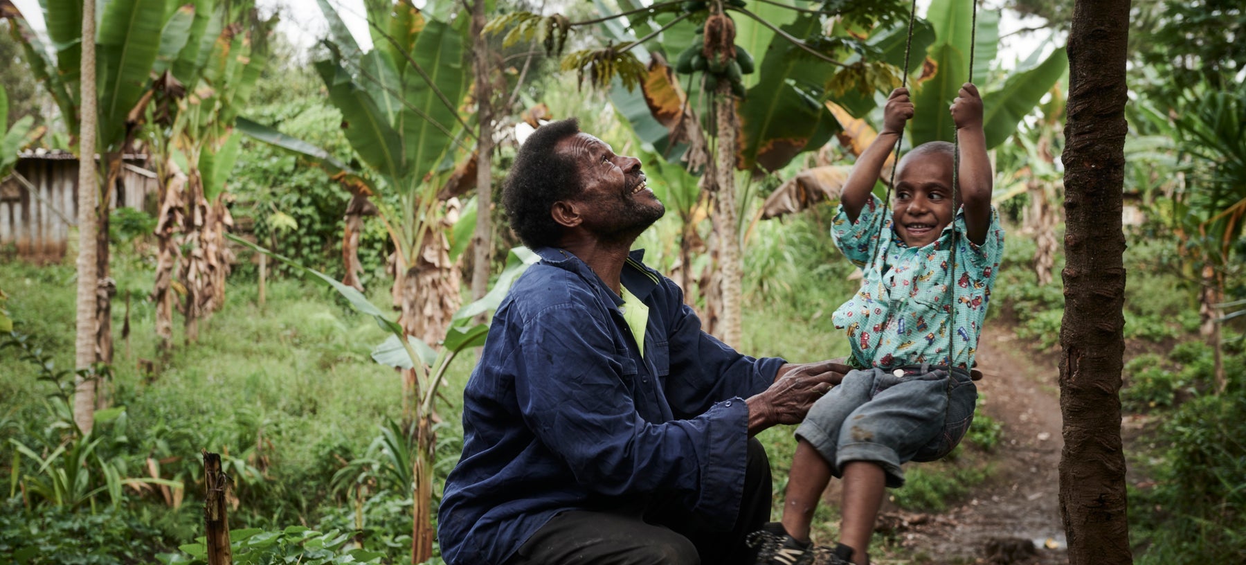 Father and child playing outdoors