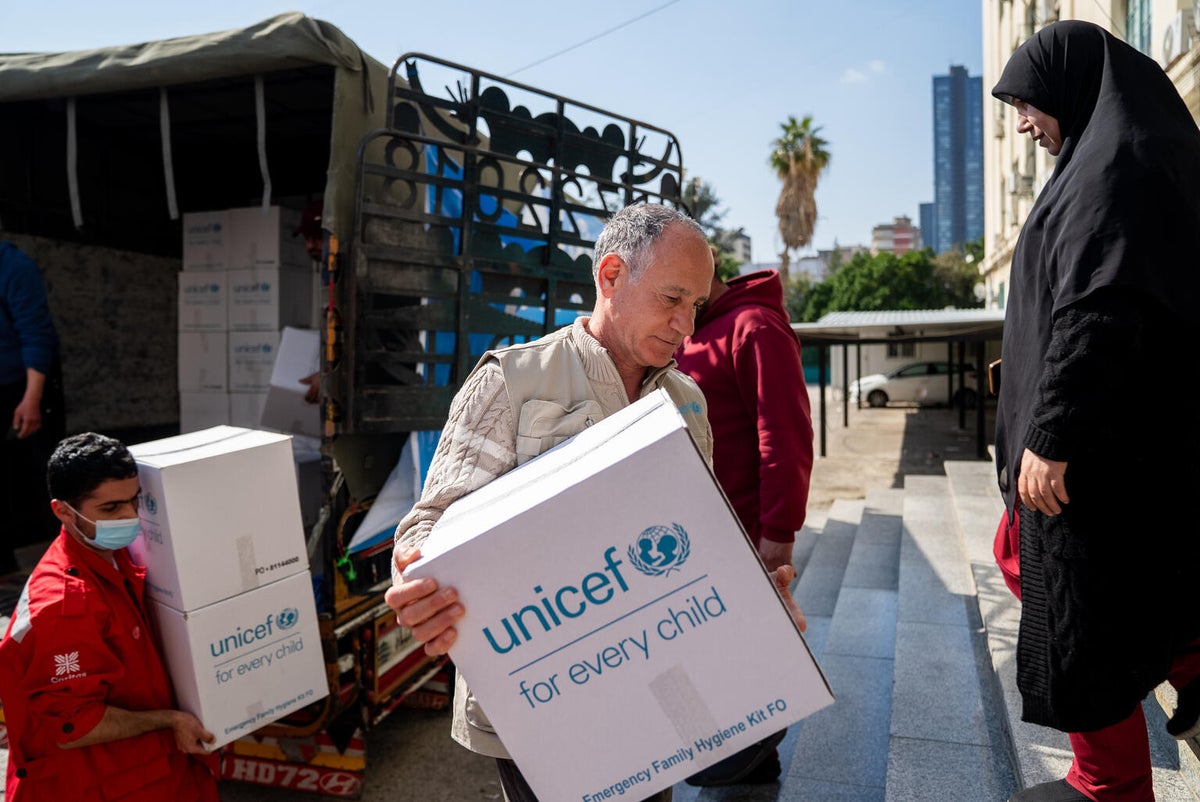 Man unloads supplies from truck
