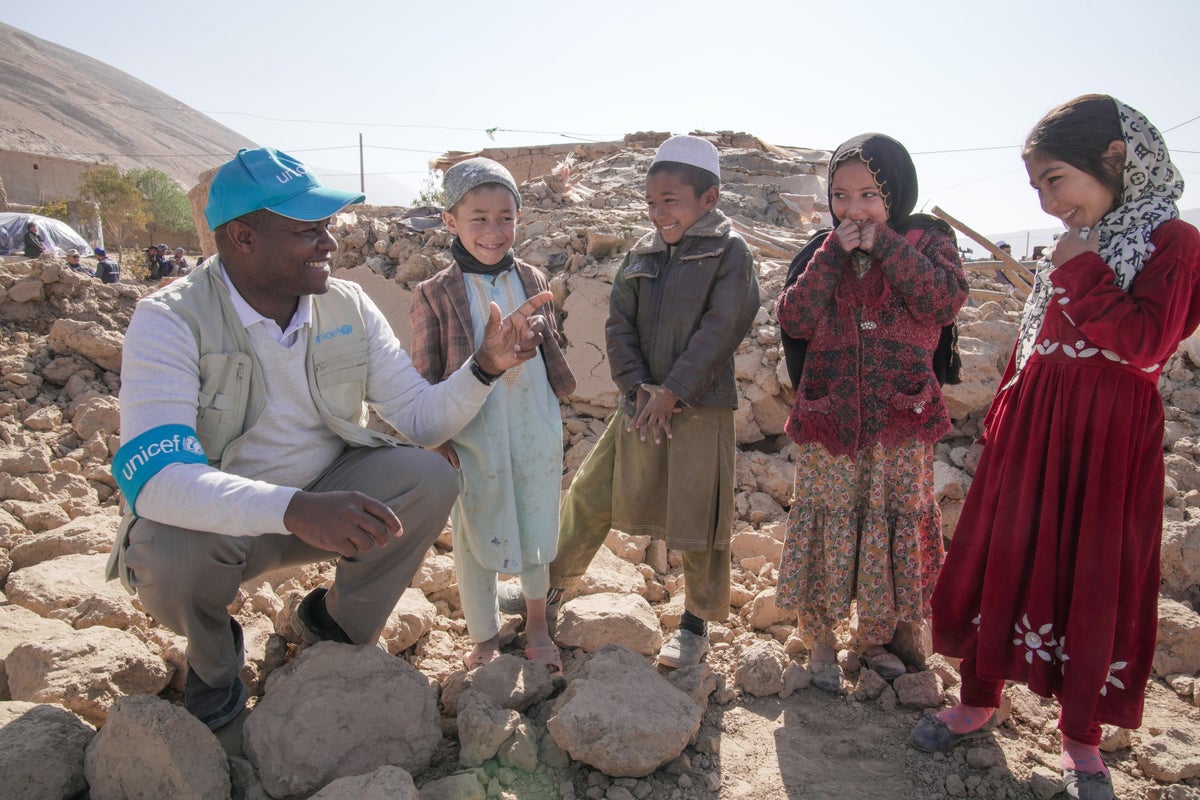 A UNICEF Senior Emergency Coordinator speaks with children in Afghanistan following the earthquakes.