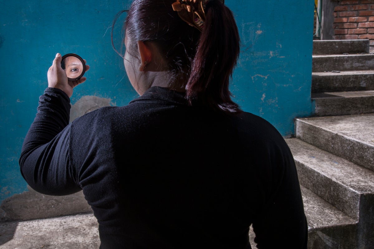 This woman, now an adult, spent many of her teenage years with the armed group in Colombia.