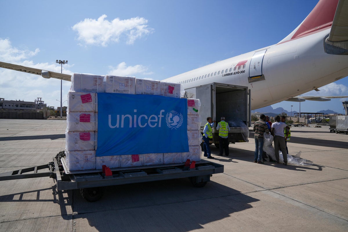 The arrival of a routine vaccine shipment via plane. 