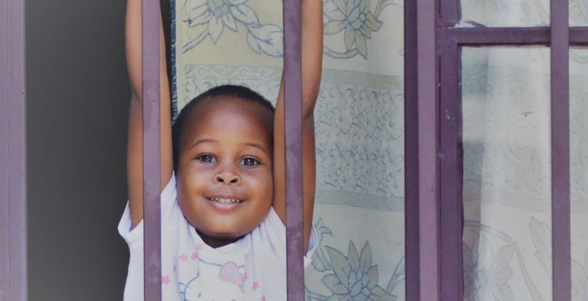 Child looking out window