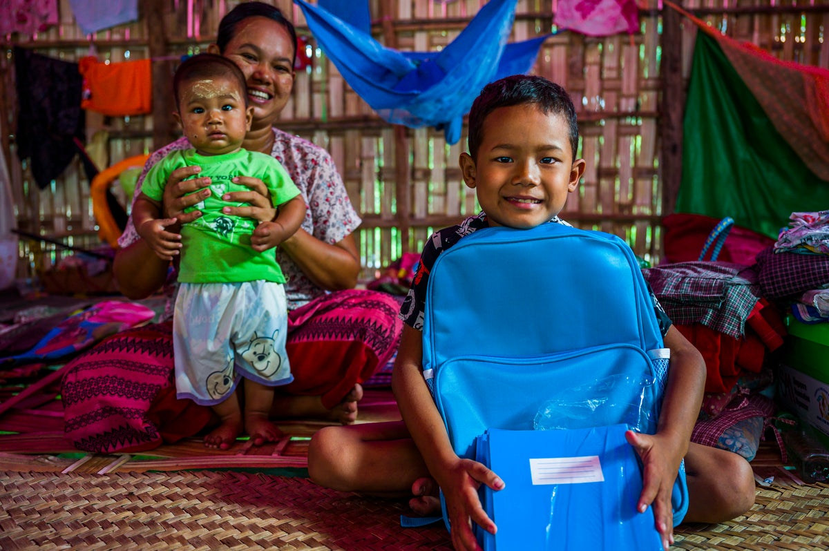 Nine-year-old Mg Zaw, who is in Grade 3, holds the Essential Learning Package (ELP) he received from UNICEF after the earthquakes. 