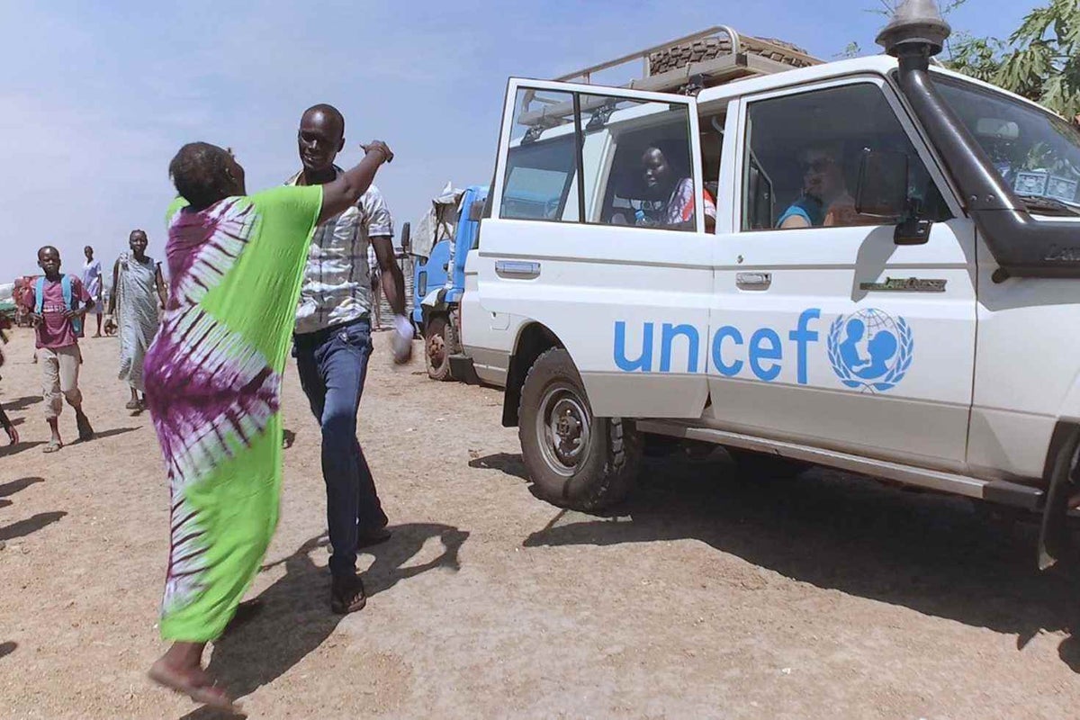 Jidu hugs his mother, Khamisa Adams, for the first time in almost five years. 