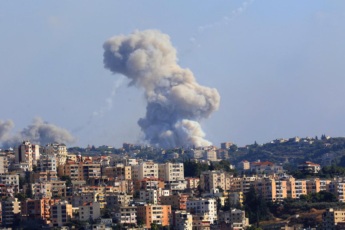 Smoke billows from a site targeted by shelling in the southern Lebanese village of Zaita on 23 September 2024.