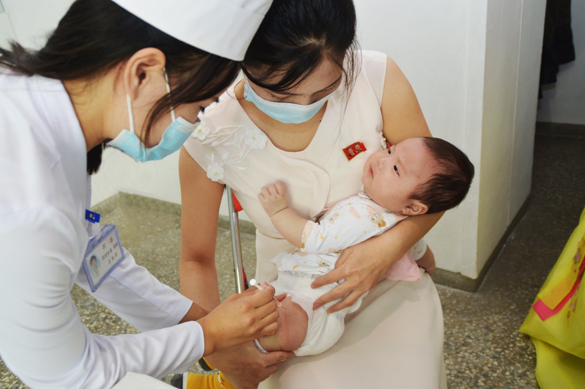 A baby at a hospital in North Korea for the start of the vaccination campaign