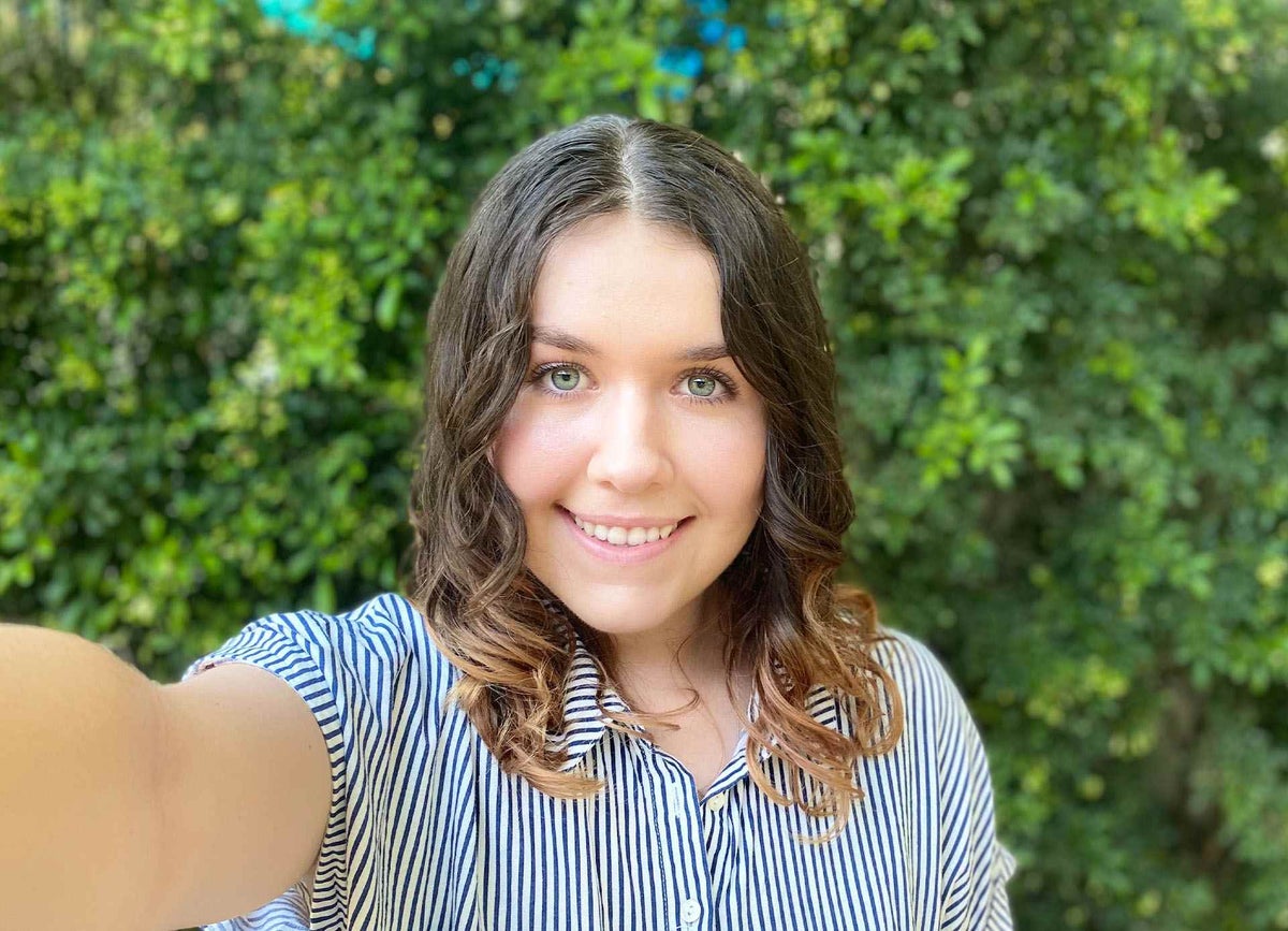 Grace smiles at the camera