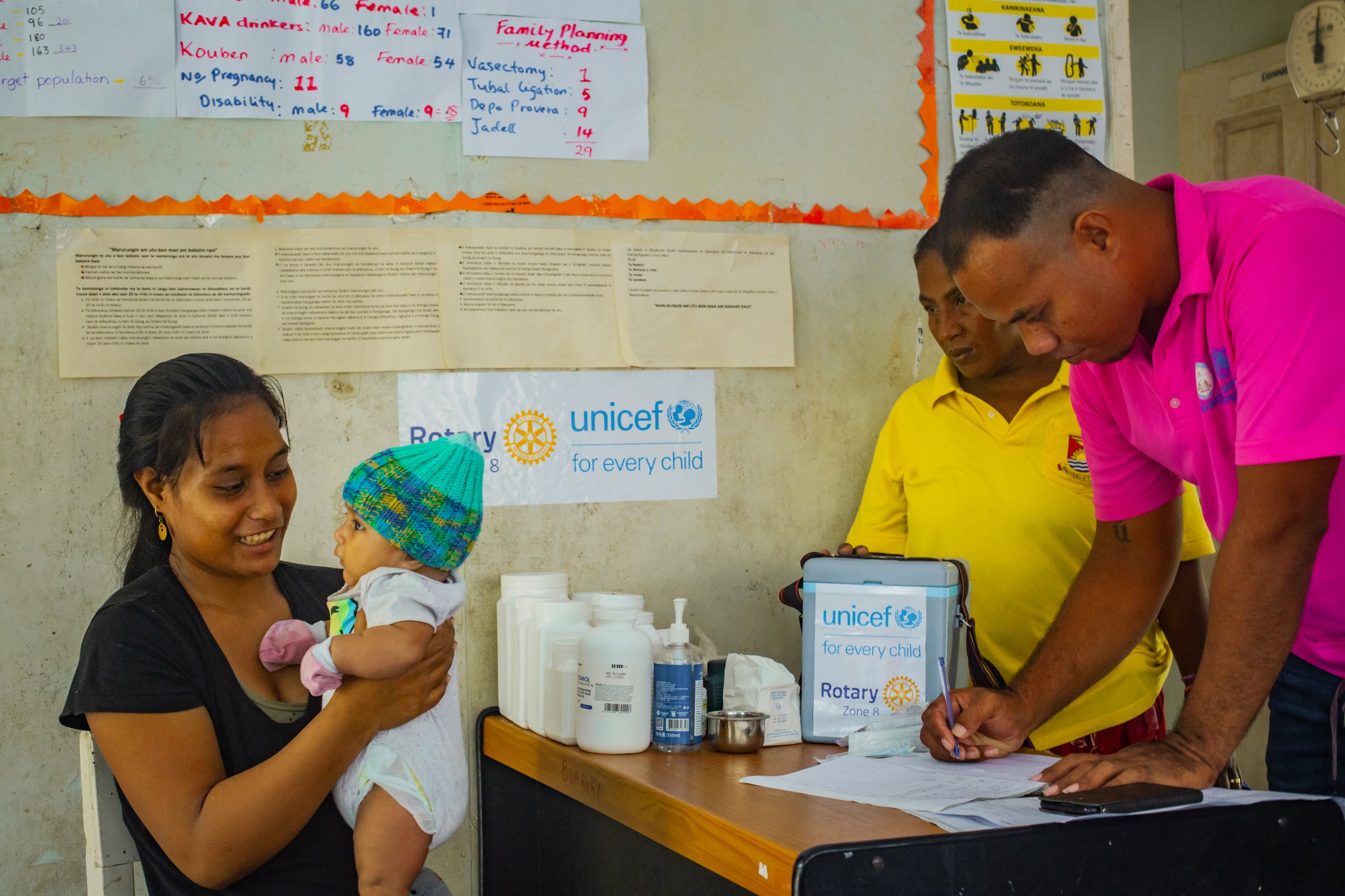 Mother holding her baby in a health clinic