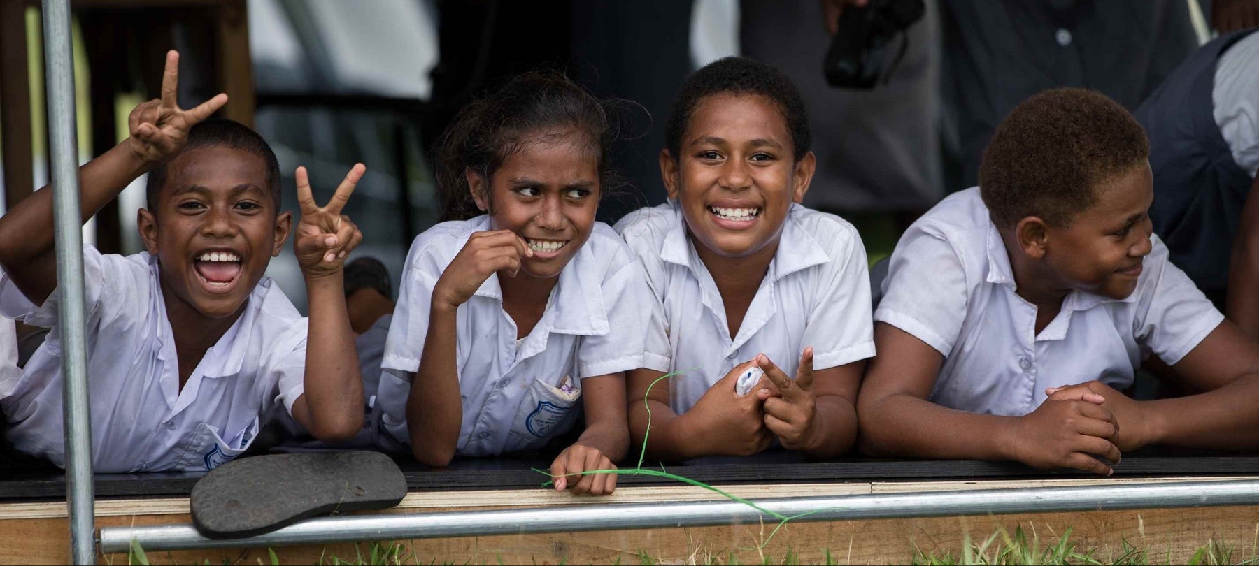 School children from Fiji smiling at the camera