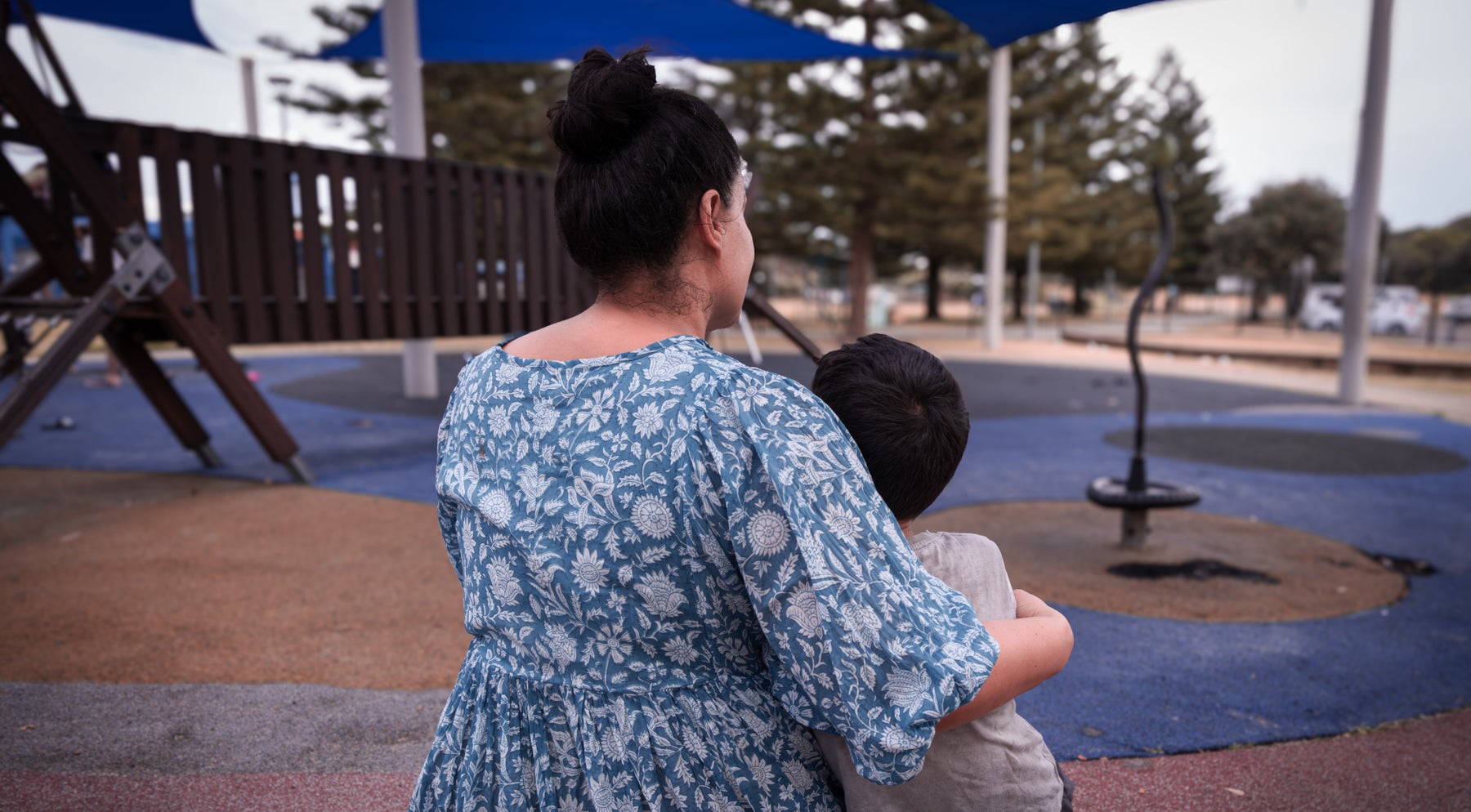 A mother comforts her child.