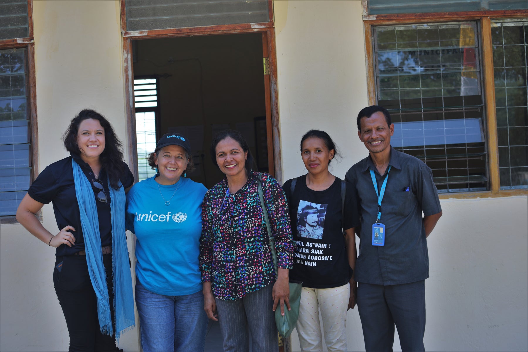 UNICEF staff and Child Protection officers are gathered together.