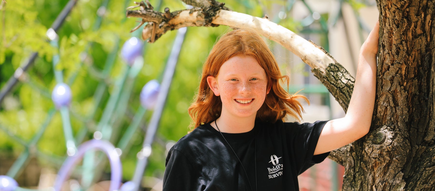 A girl smiles to the camera