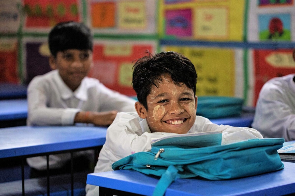 A young boy sits in his classroom at a learning centre in the Rohingya refugee camp.