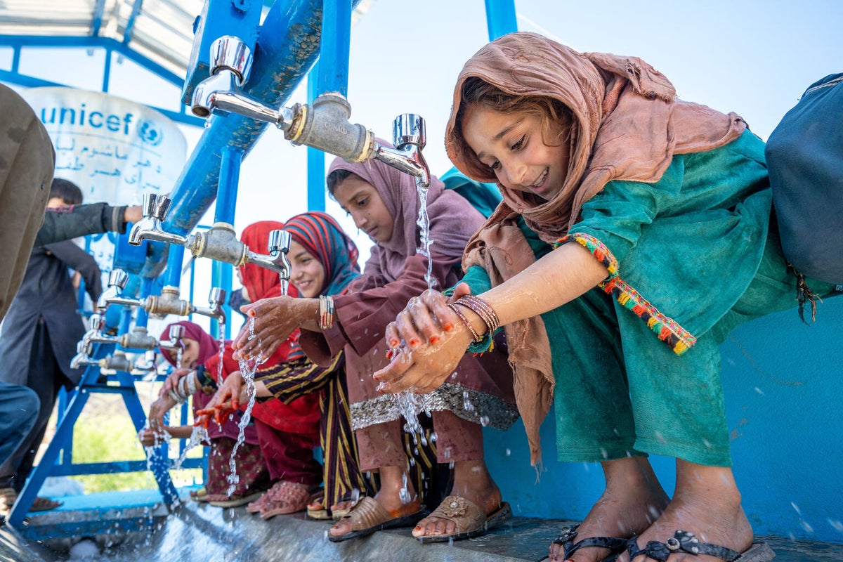 In Afghanistan, nine-year-old Marzia washes her hands with clean water from a UNICEF-supported wash facility.