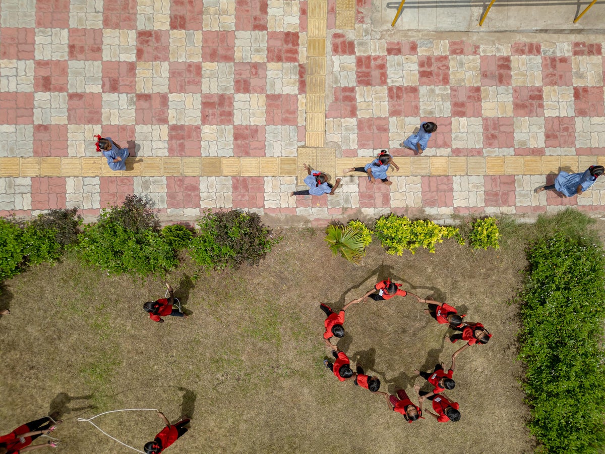 Ramps, railing, tactile pavers and contrast colours are used at a school in India to address the challenges of children with blindness, low vision and mobility disabilities.