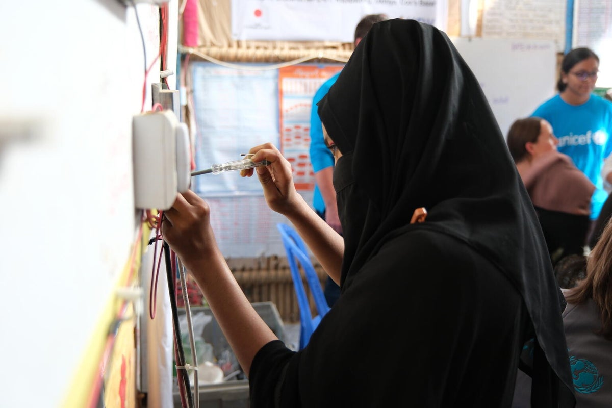 A girl demonstrates some of the new skills she learnt in the multi-purpose centre.
