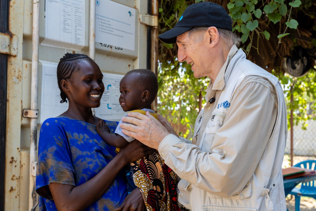 UNICEF Goodwill Ambassador Liam Neeson meets a mother and her 14-month-old son