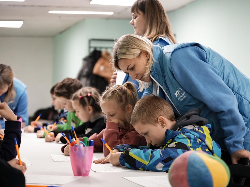 Children at a UNICEF-supported community centre take part in activities to support their mental health during power blackouts caused by the war. 