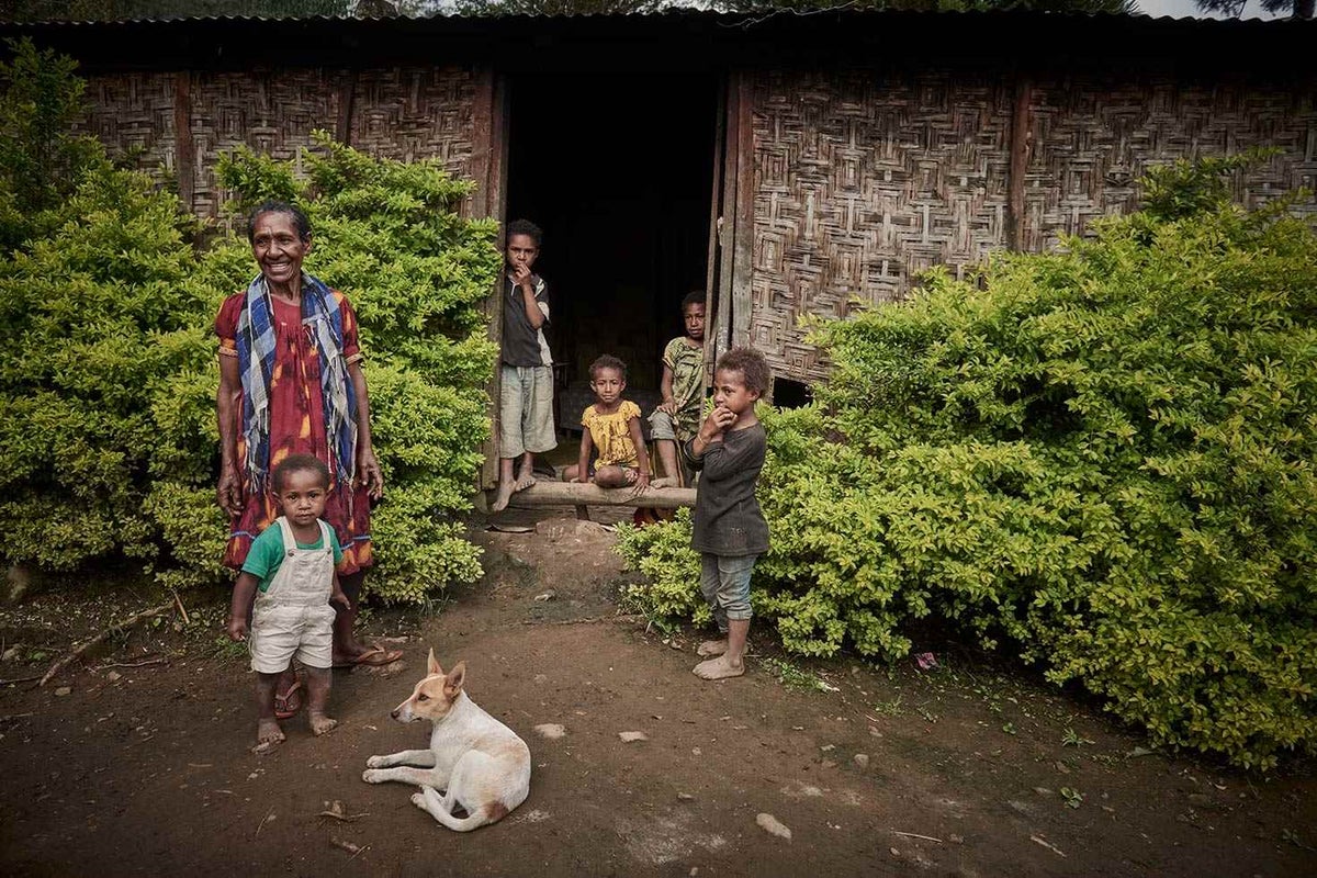 Tobia with five of her six grandchildren that she cares for in her home in the mountainous region of Chimbu, PNG