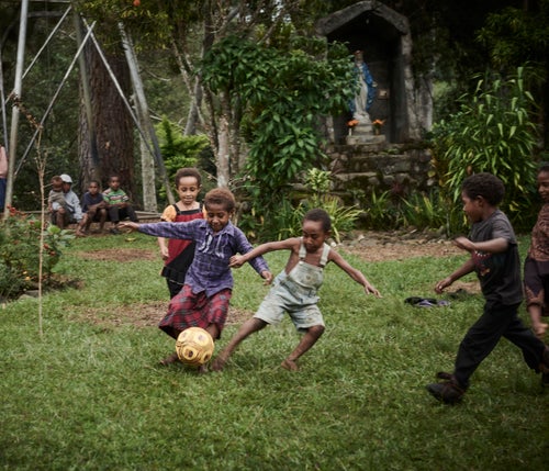 Children playing soccer